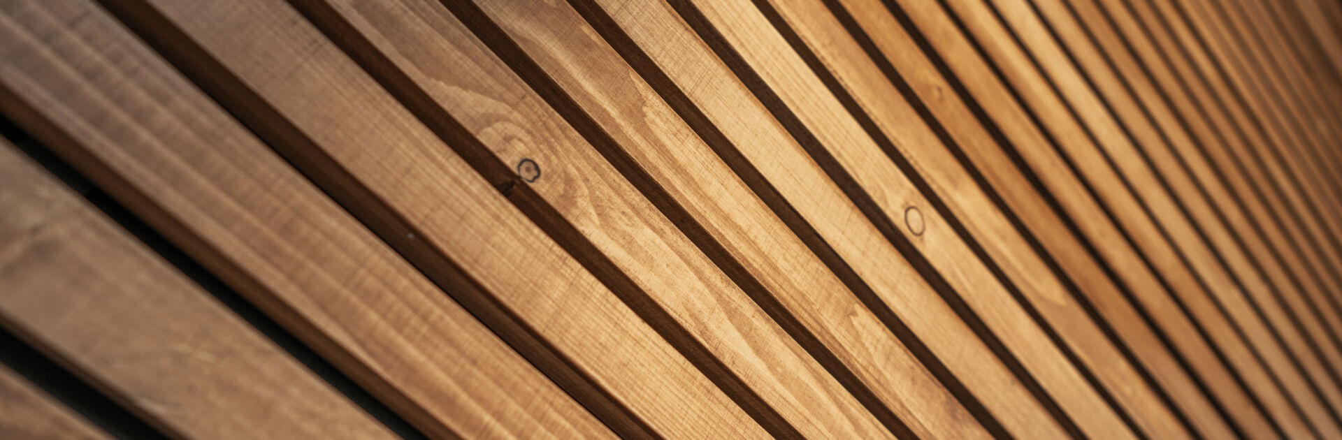 Wooden Lamellas Decorative Wall Close Up. Modern Architectural Materials